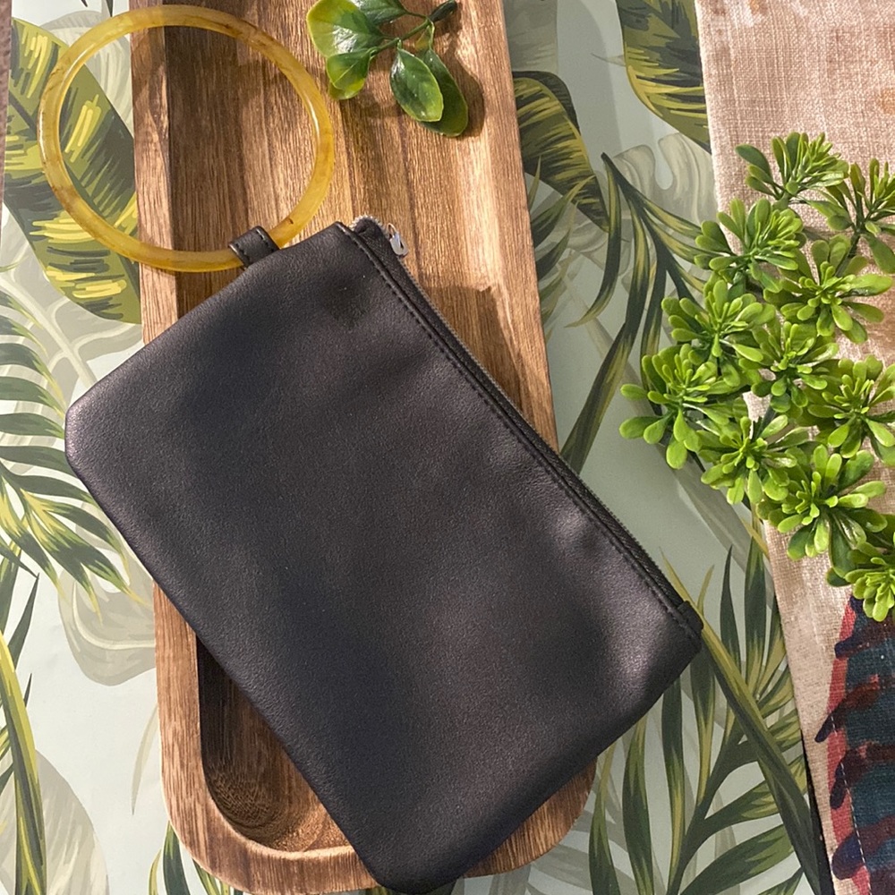 Black pleather wristlet with clear brown handle